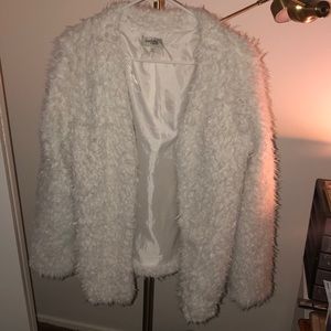 White furry jacket